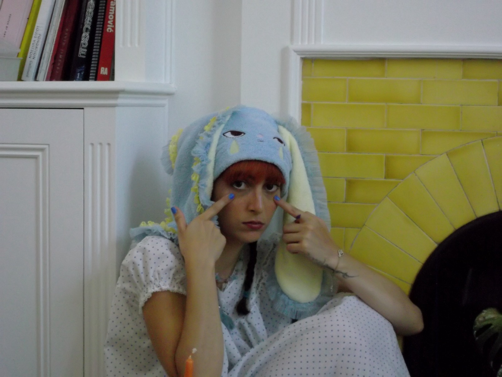 Close portrait of a model wearing the blue HOHOMIE bunny cap