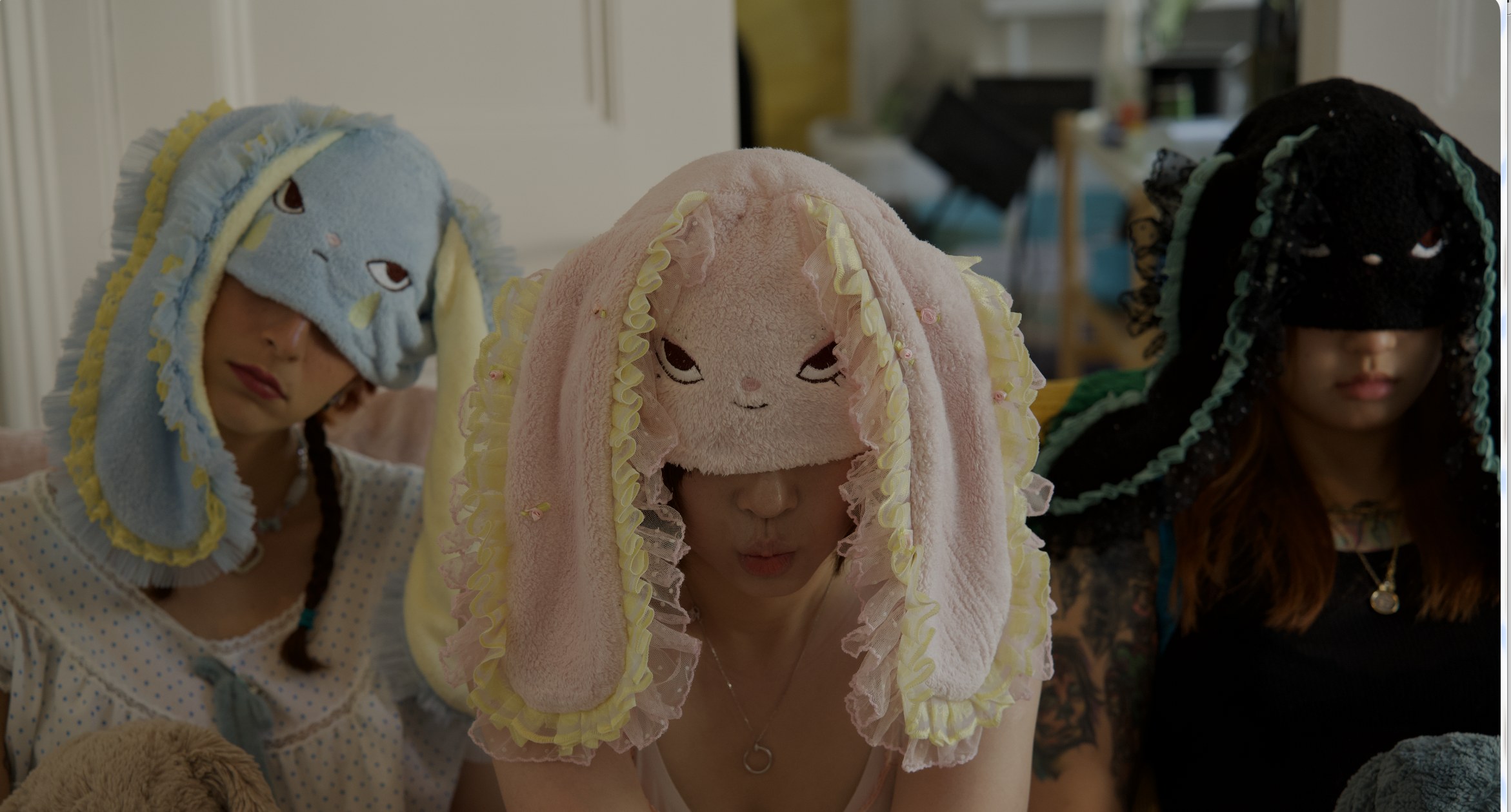 Three models wearing HOHOMIE bunny hoods
